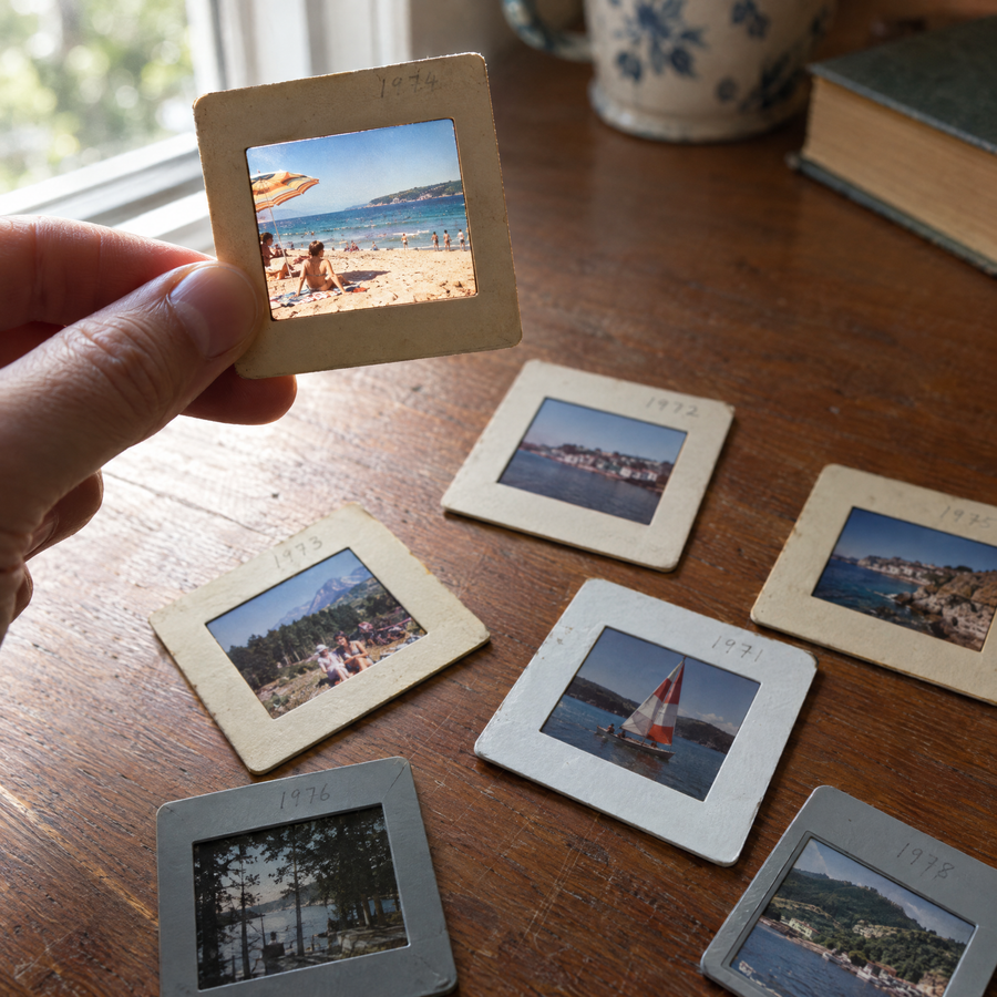 A 35mm mounted slide held between fingers